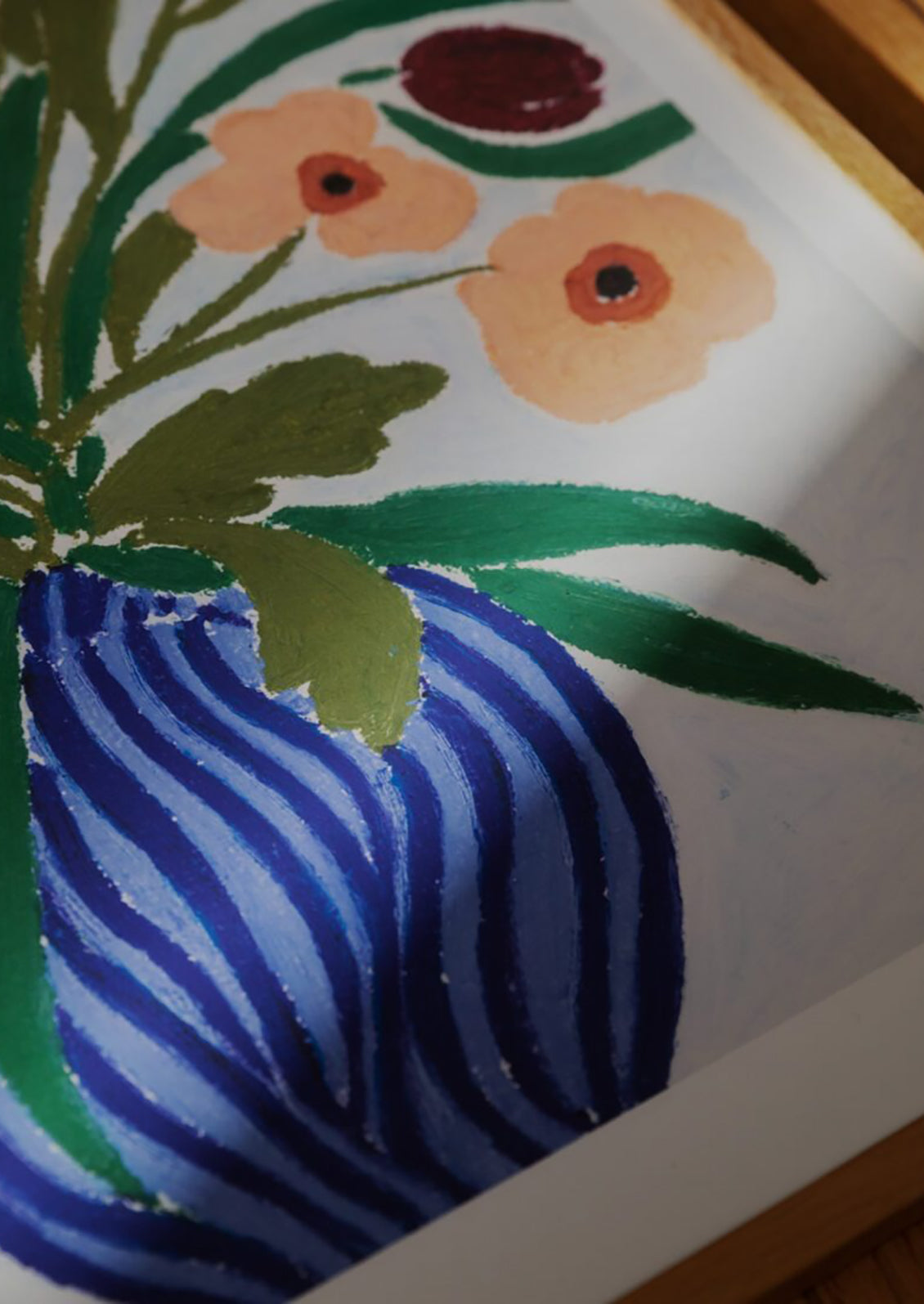 Decorative painting of a blue vase with flowers on a white background