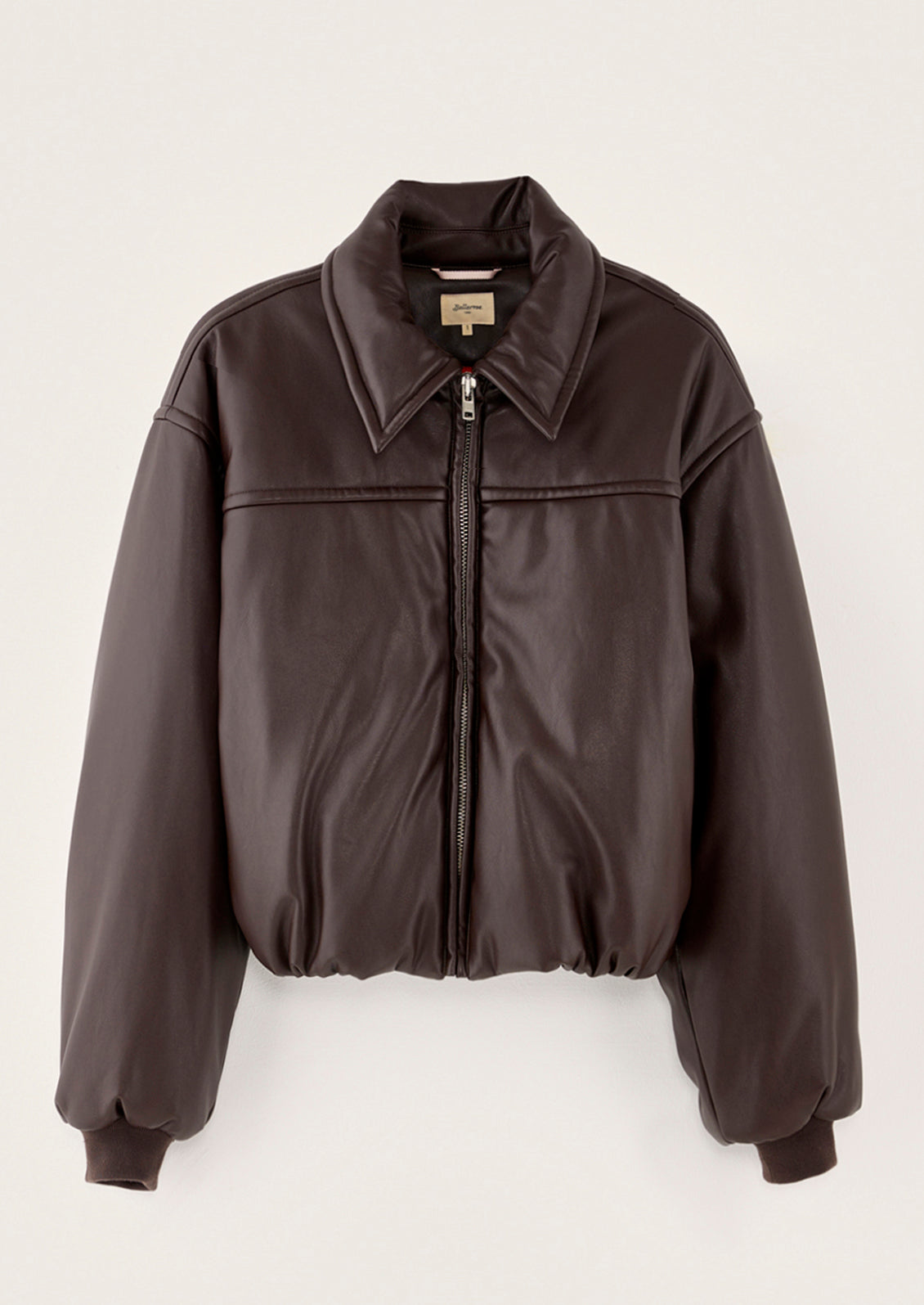 A bomber style jacket in brown faux leather.