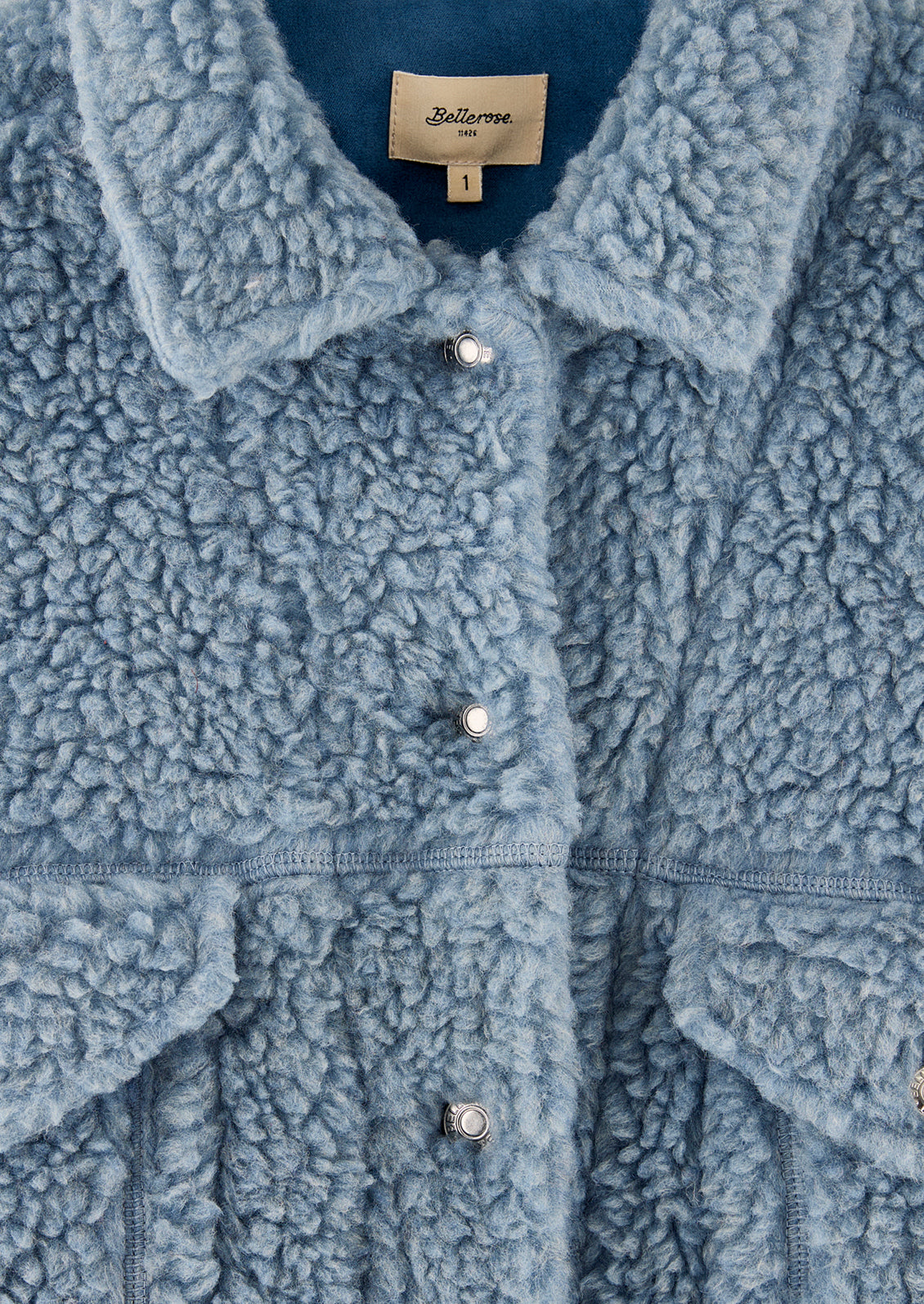 An oversized short jacket in dusty blue fleece.