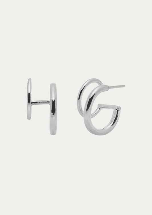 A pair of sterling silver earrings with two hoops.