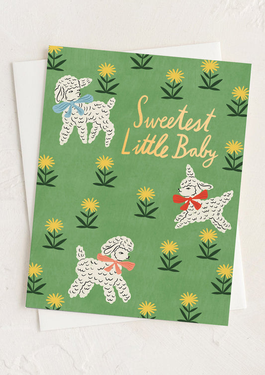 Greeting card with illustrations of lambs and flowers on a green background