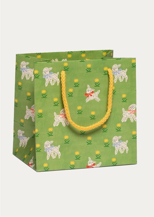 Green gift bag with lamb pattern on a white background