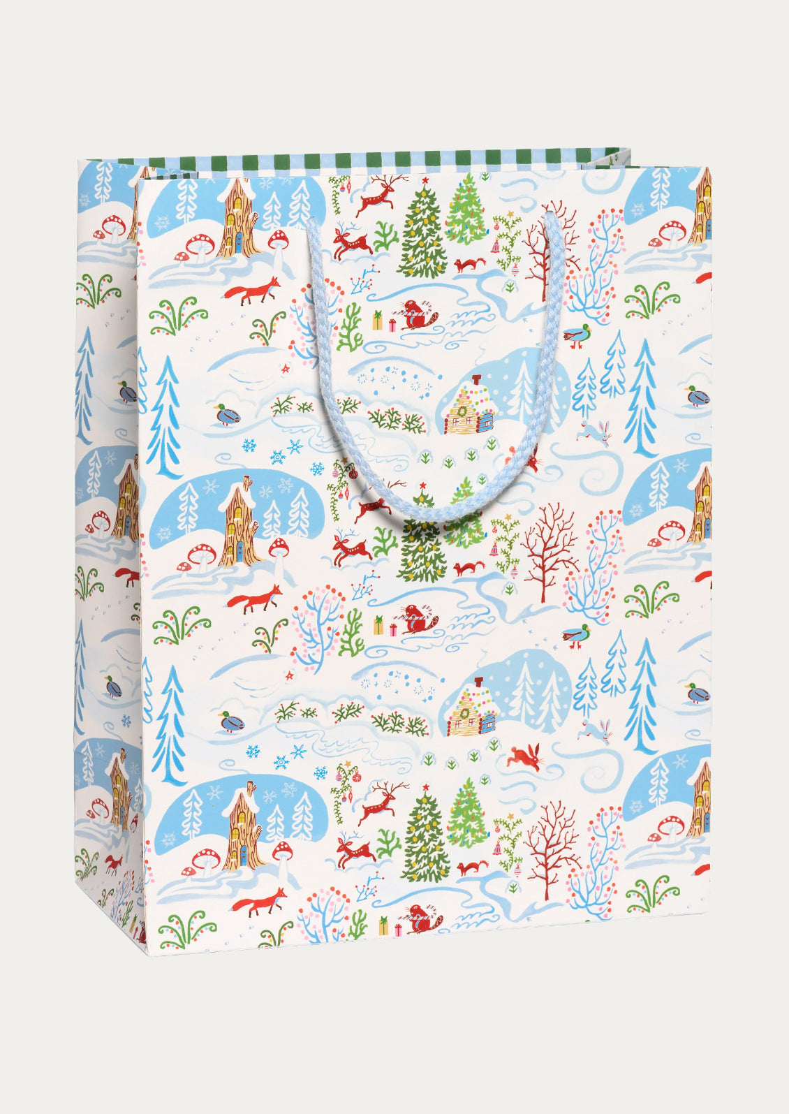 A large gift bag with blue and white winter wonderland scene.