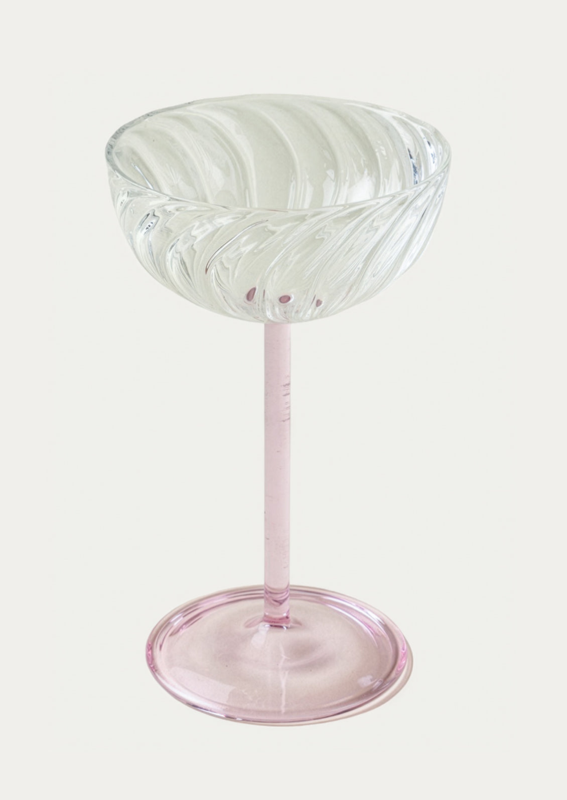 Clear glass with pink base on a white background