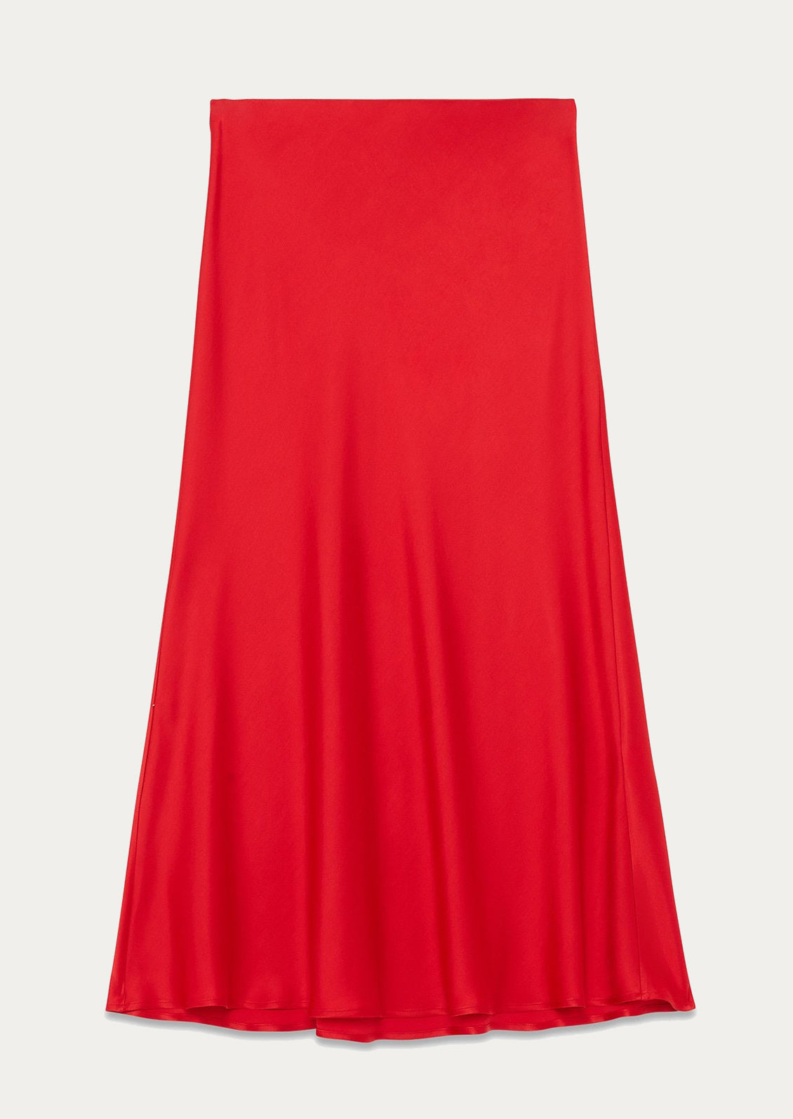 A woman wearing a red flowy sateen skirt.