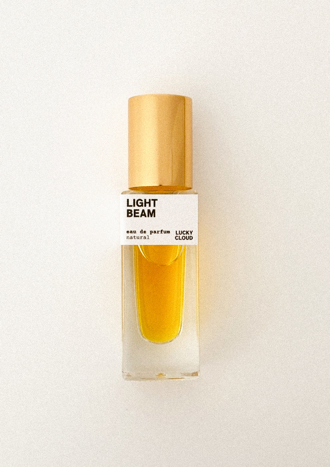 Perfume bottle labeled 'Light Beam' on a white background