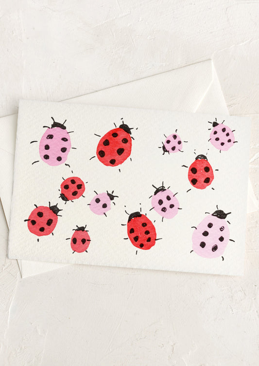 Card with ladybug illustrations on a white background