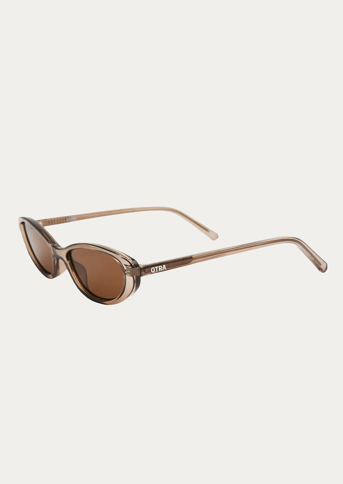 A pair of cat eye sunglasses with a transparent olive frame and brown lenses.