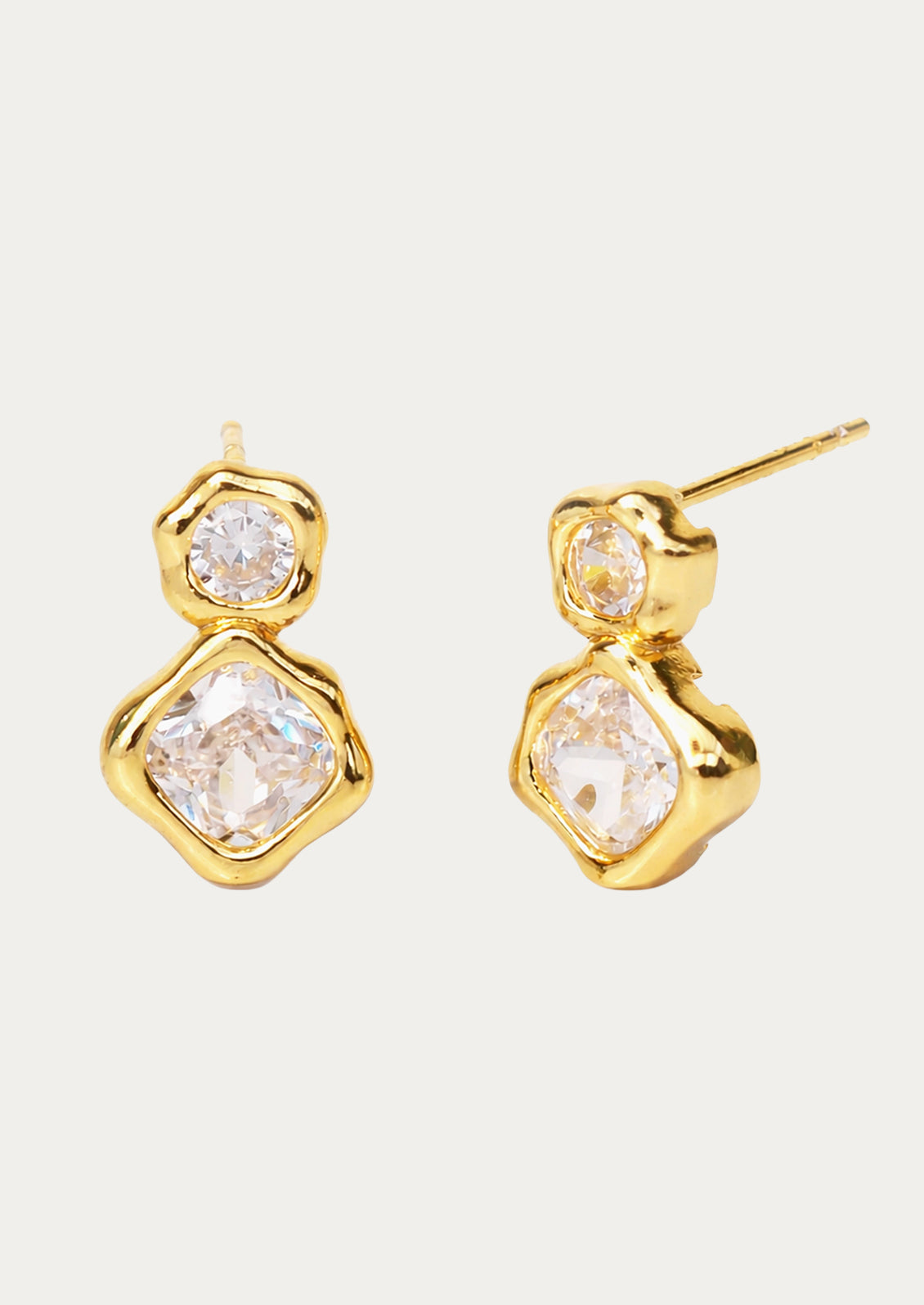 A pair of gold earrings with two stacked crystal gems.