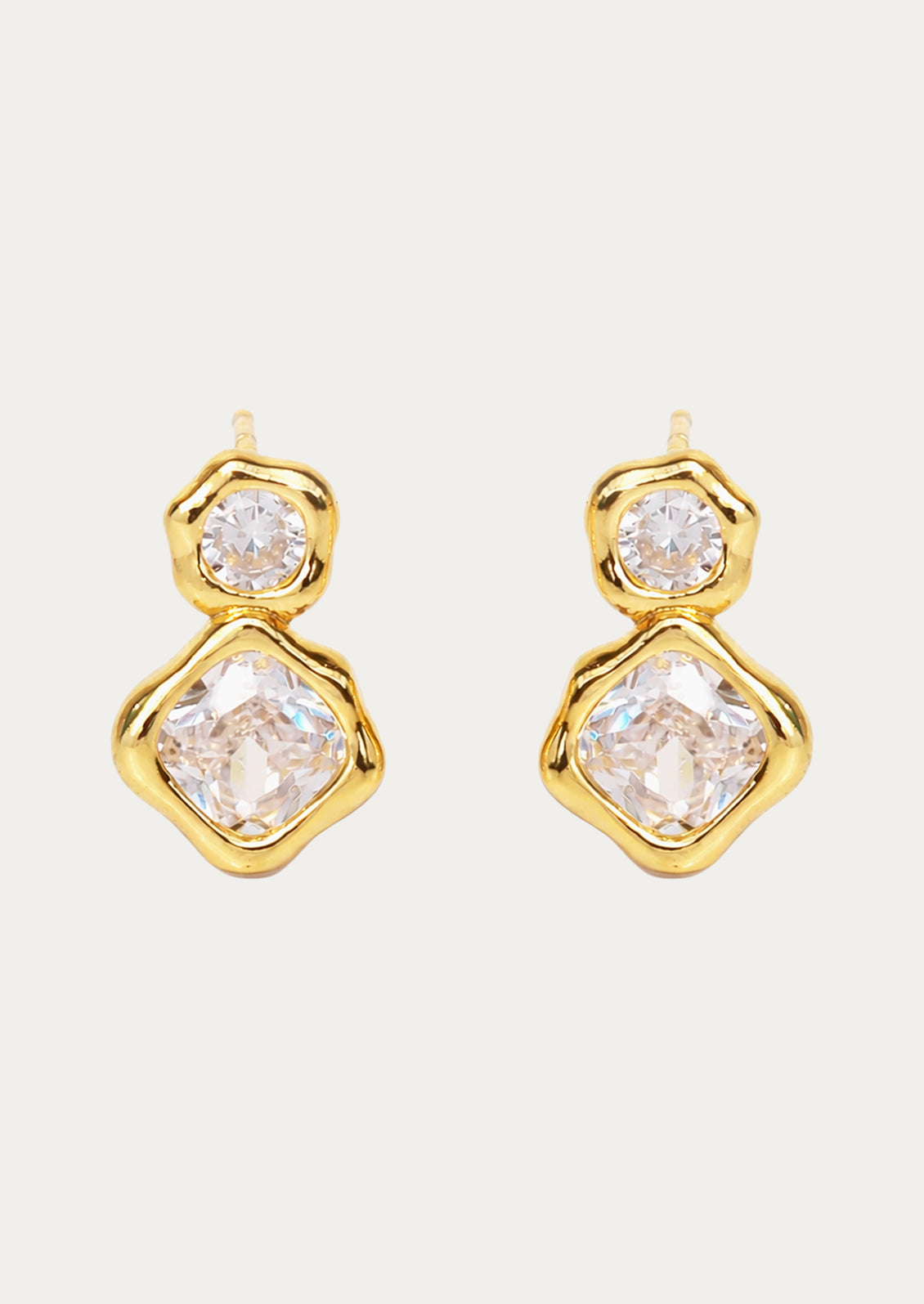 A pair of gold earrings with two stacked crystal gems.