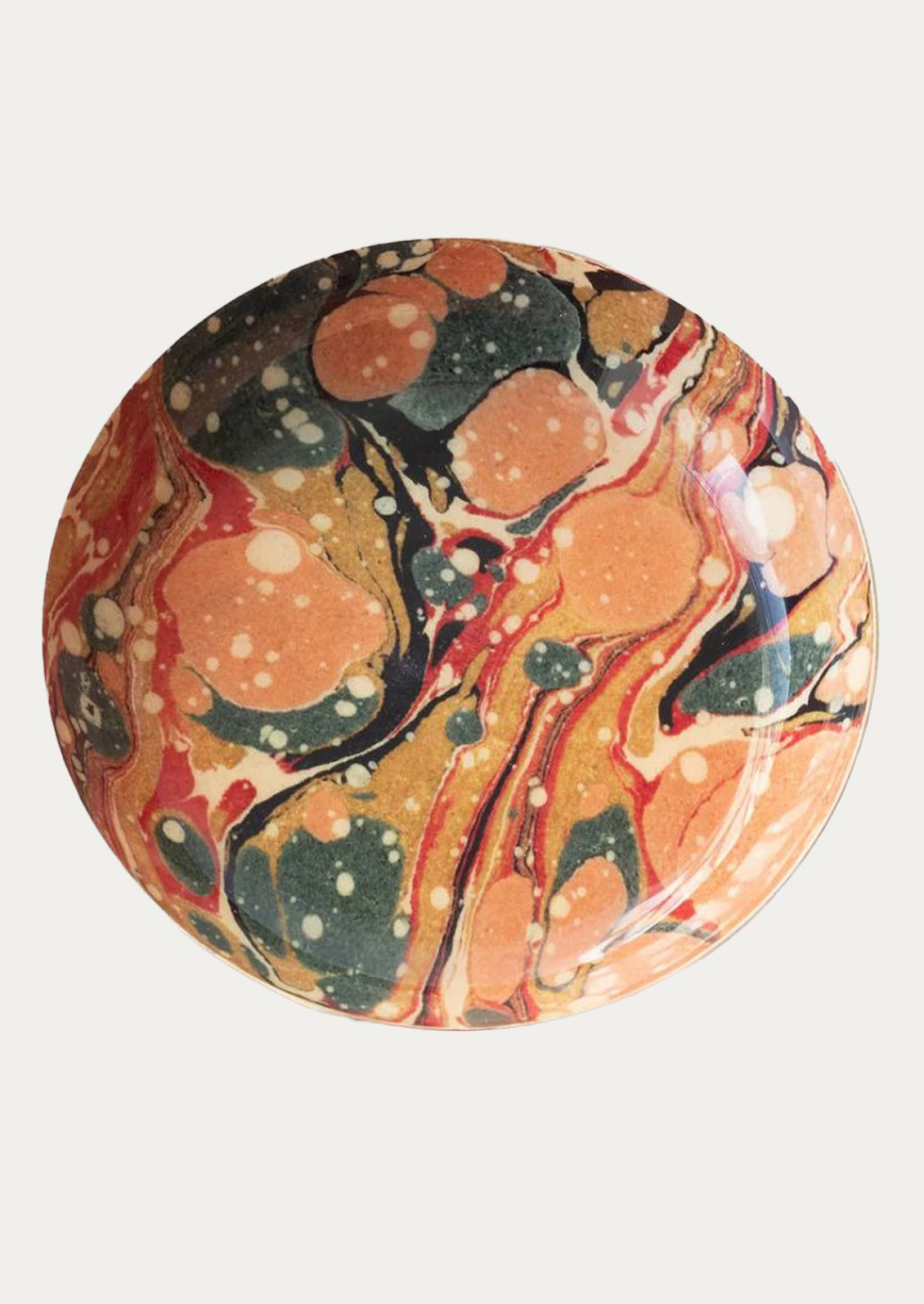 Marbled round tray with orange, black, and green colors on a white background