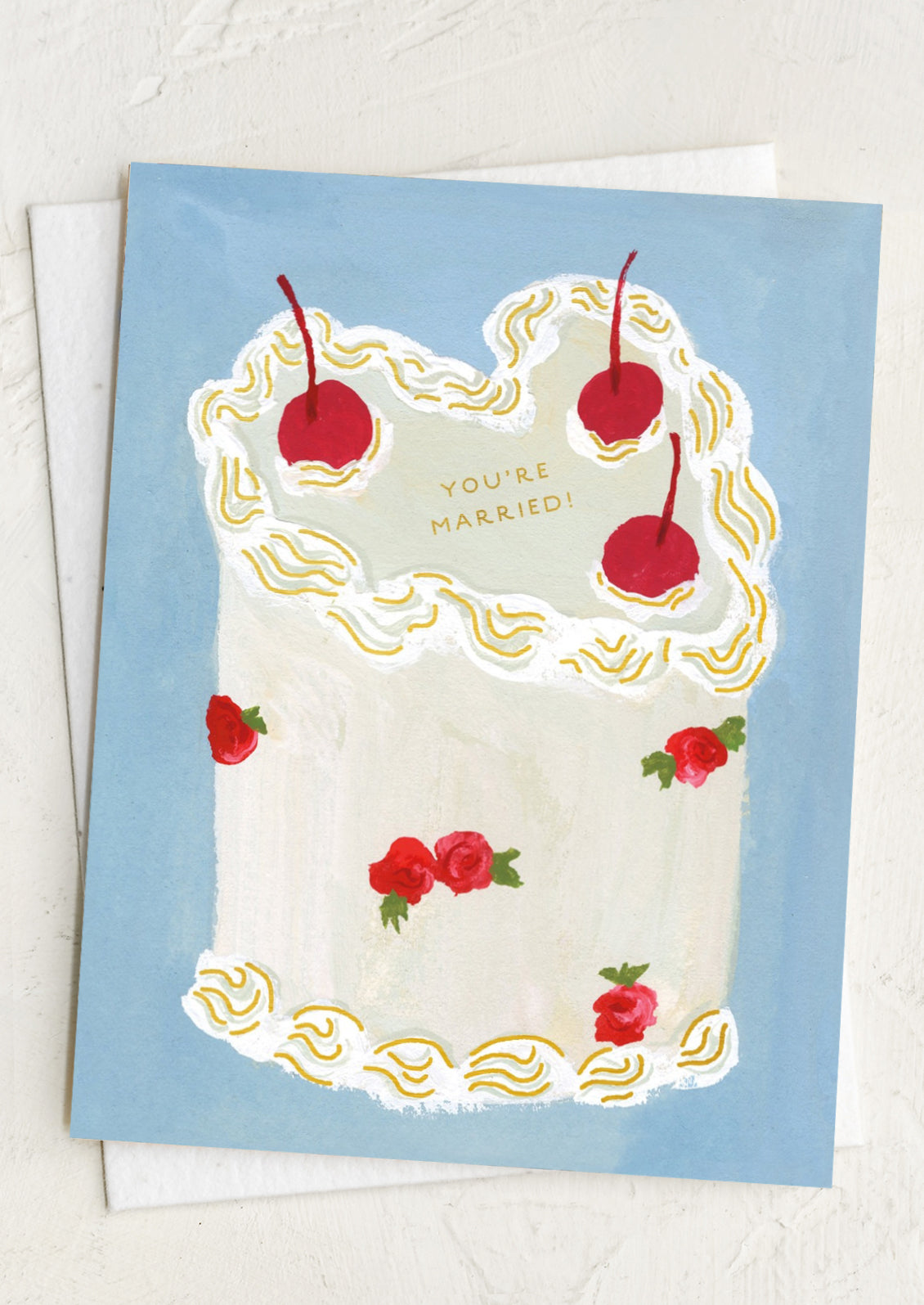 Wedding cake card with cherries and roses on a light blue background, text reads "You're Married!".