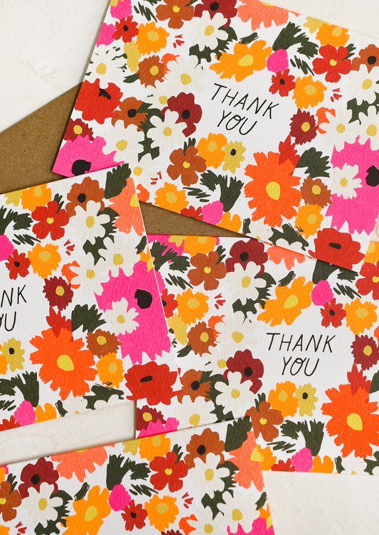 A set of neon daisy print thank you cards.