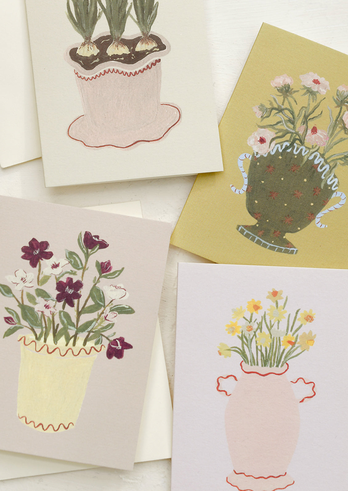 Assorted mini greeting cards with flower illustrations.