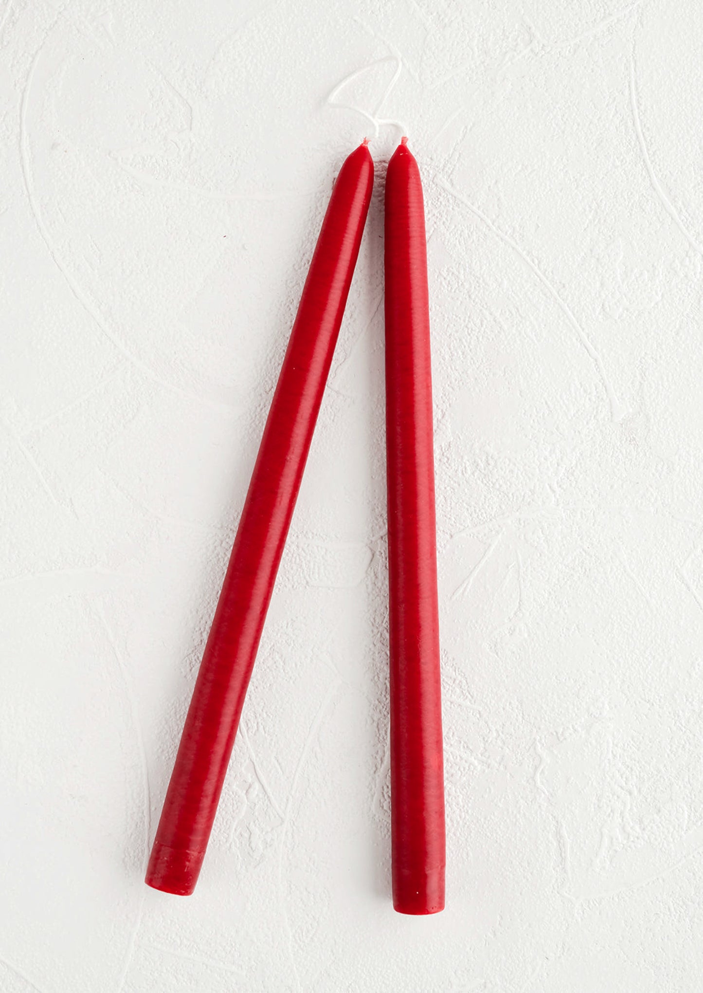 Pair of taper candles in cherry red