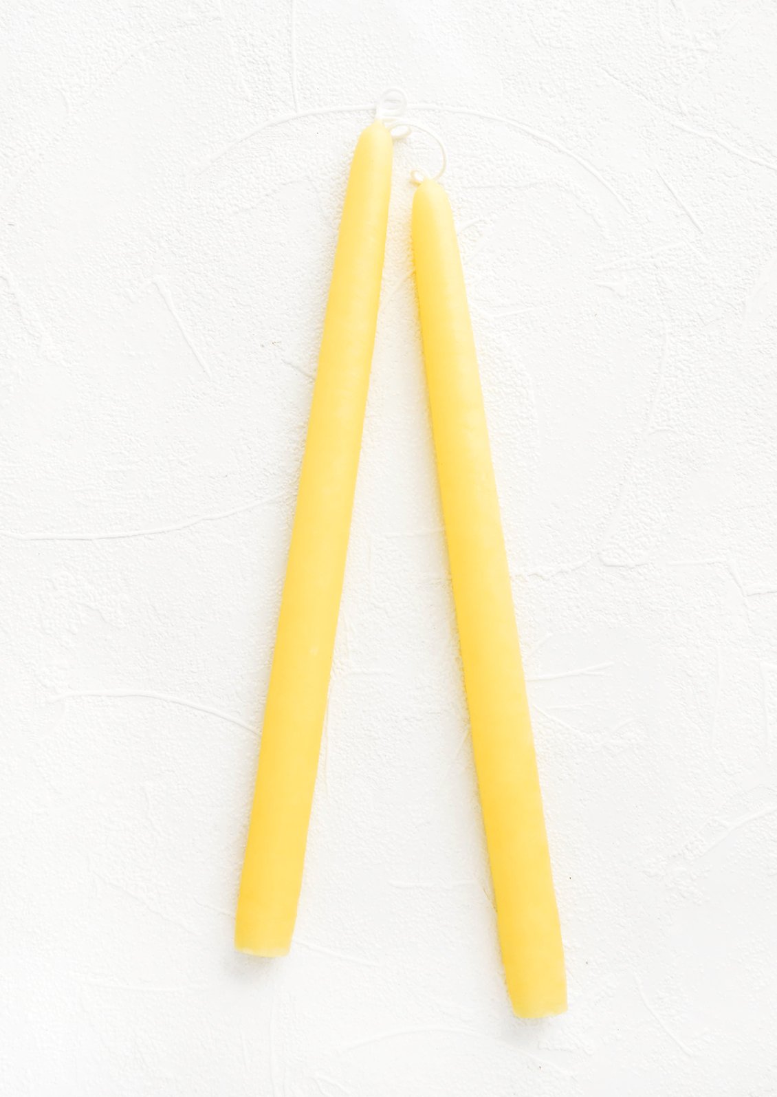Pair of taper candles in daffodil yellow