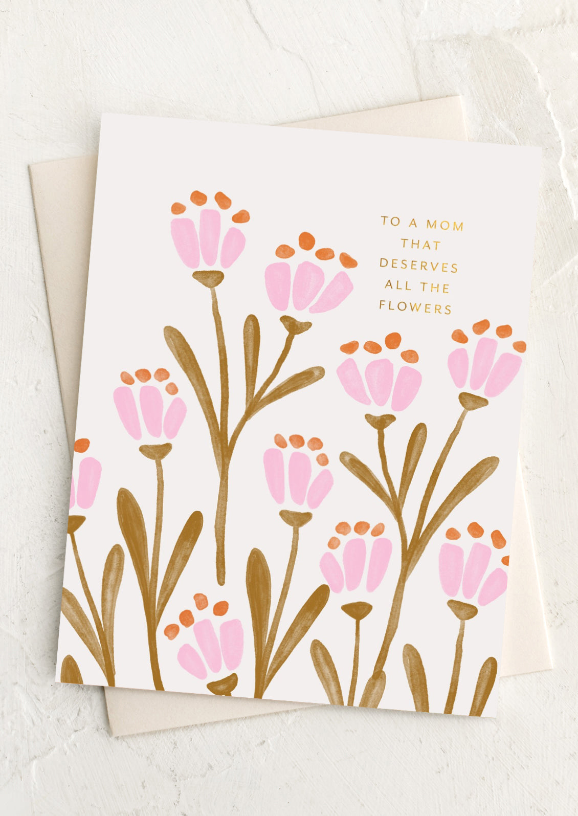 A floral print card with text reading "To a mom that deserves all the flowers".