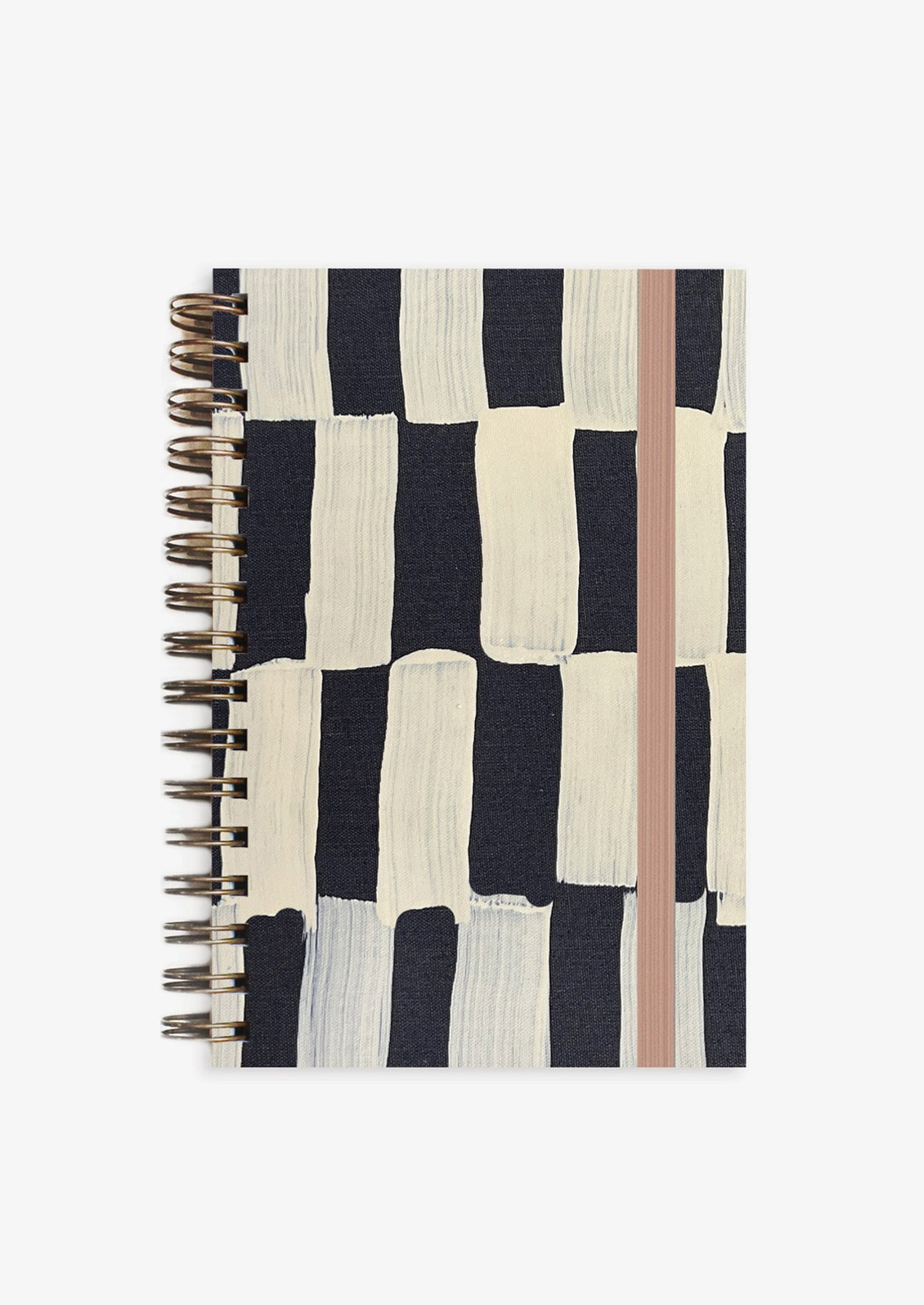 A black and white geometric painted spiral bound notebook.