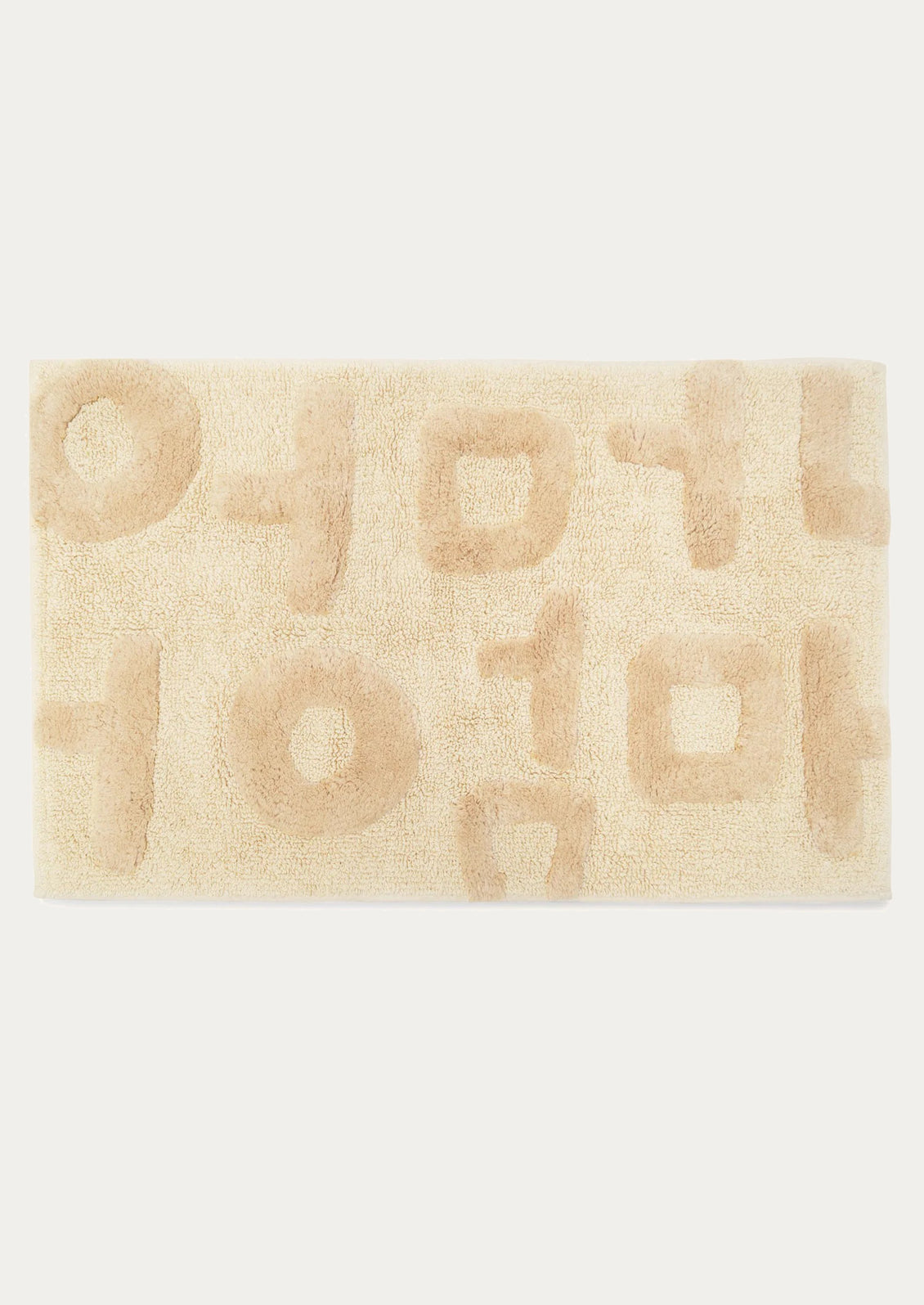 Beige bath mat with geometric pattern on a white background