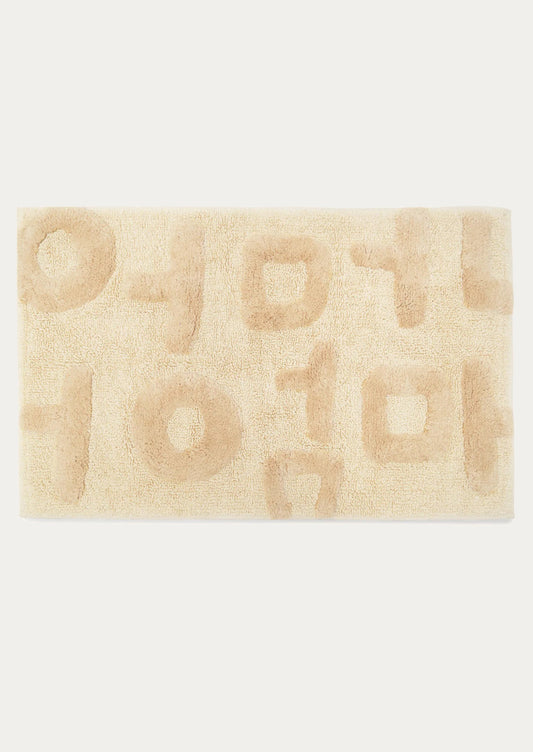 Beige bath mat with geometric pattern on a white background