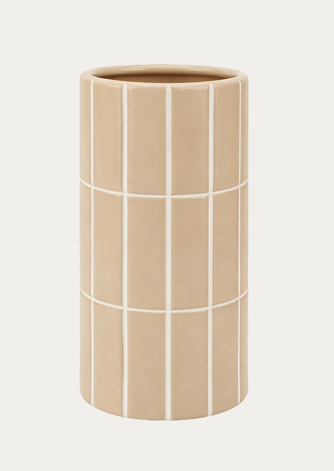 A tall, cylindrical ceramic vase in a warm beige color, decorated with a white grid pattern.