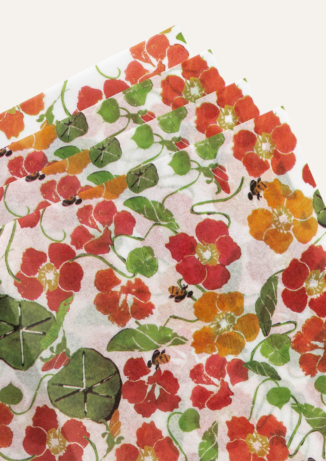 Sheets of tissue paper featuring a red and orange nasturtium flower pattern.