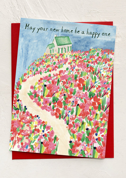 Greeting card with floral design and house illustration on a white background