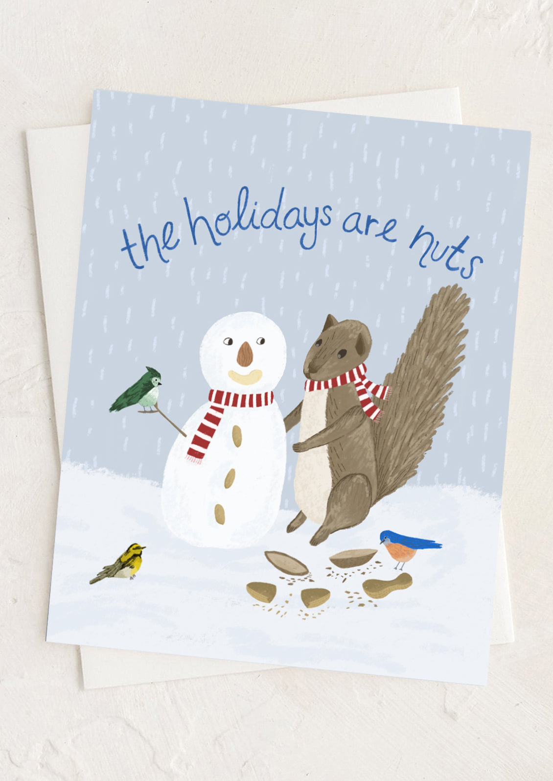 Card with a snowman and squirrel illustration and text 'the holidays are nuts' on a light blue background.