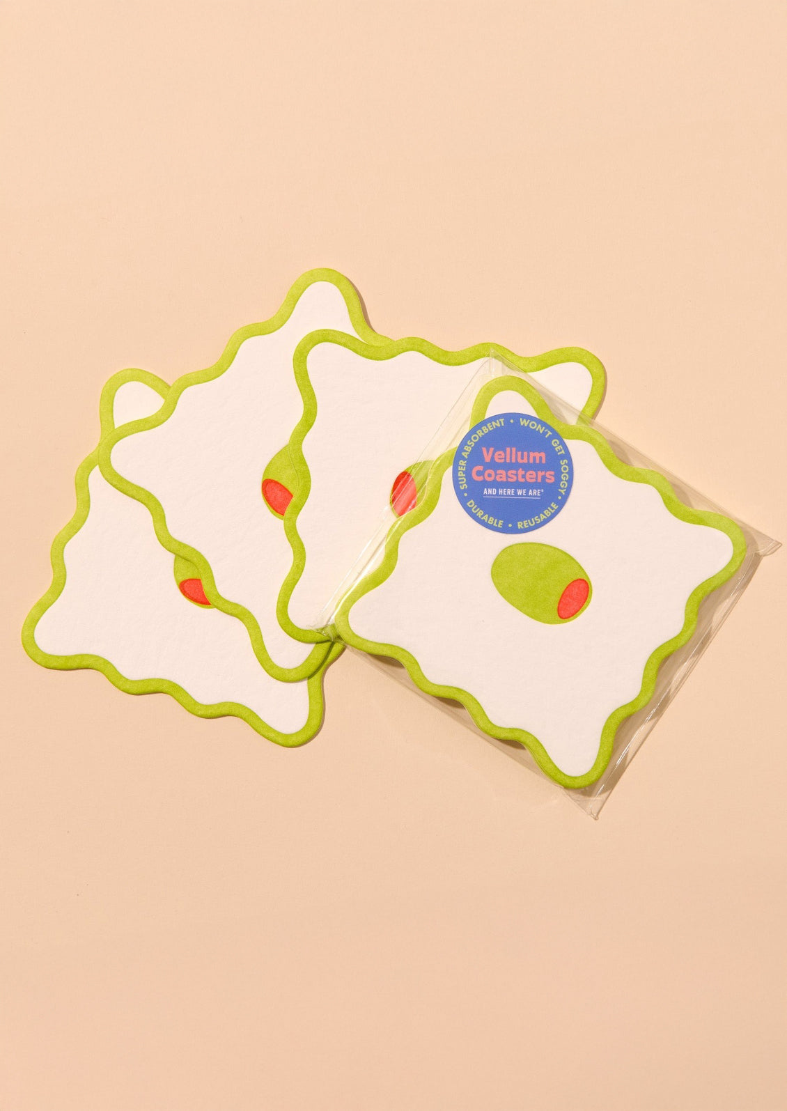 Decorative paper coasters with wavy edges and olive motif.