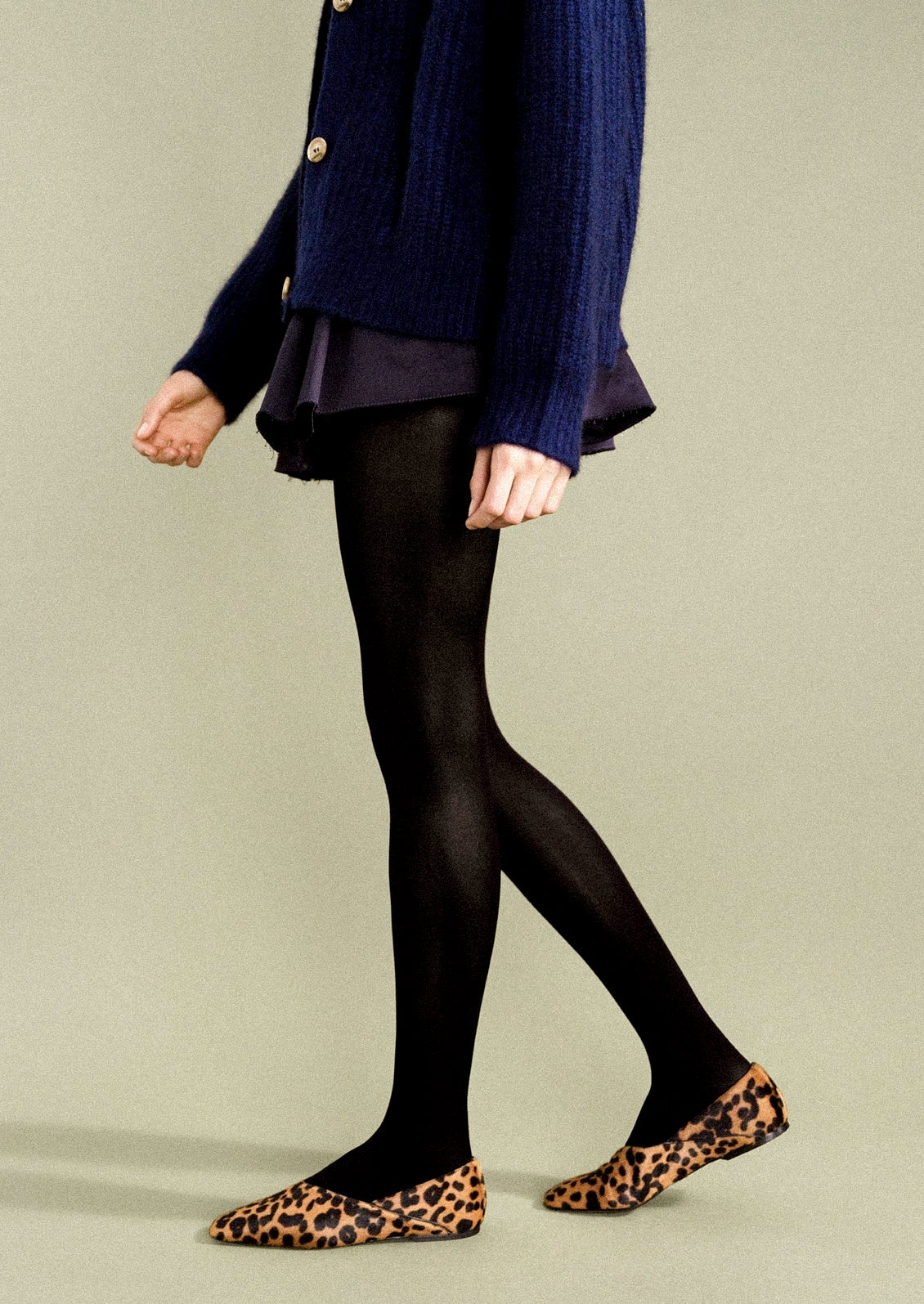 A woman wearing opaque black tights.