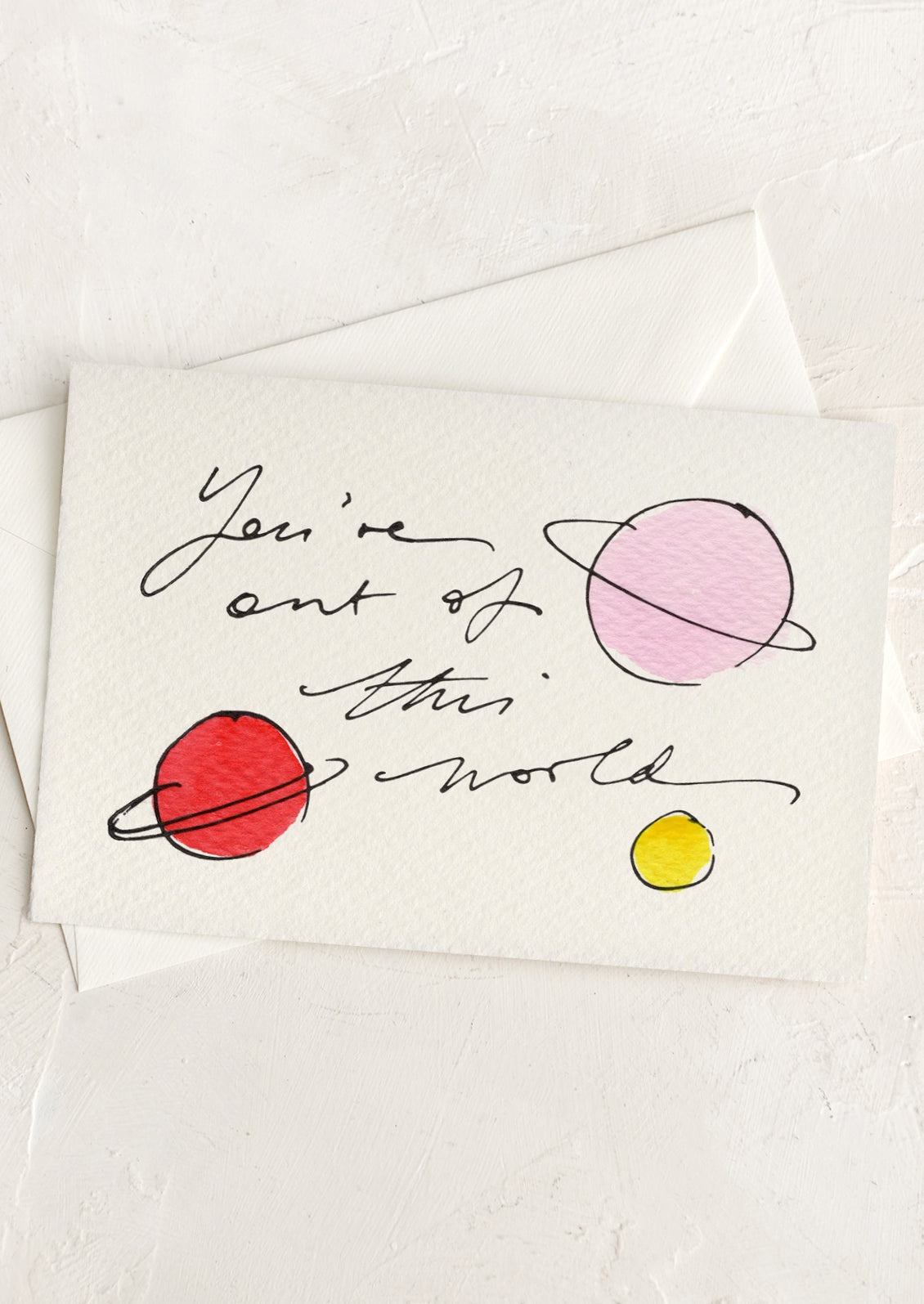 Card with 'You're out of this world' text and colorful planets on a white background