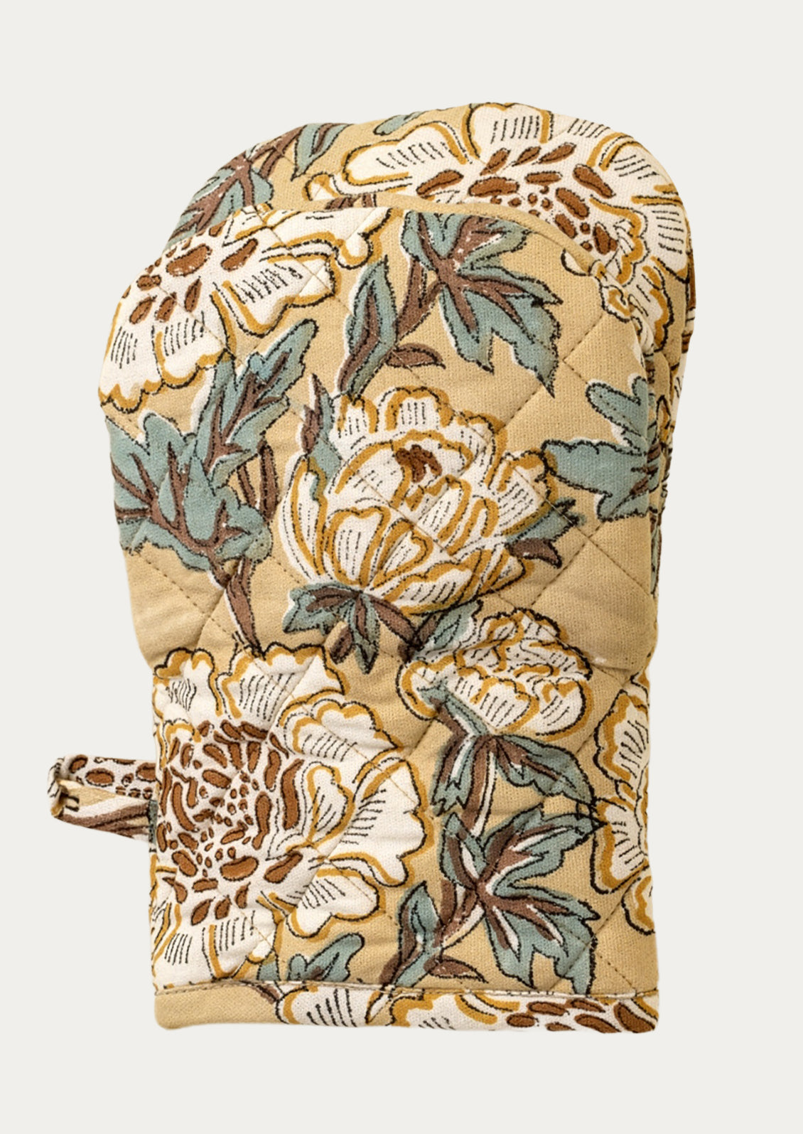 Floral patterned oven mitt on a beige background