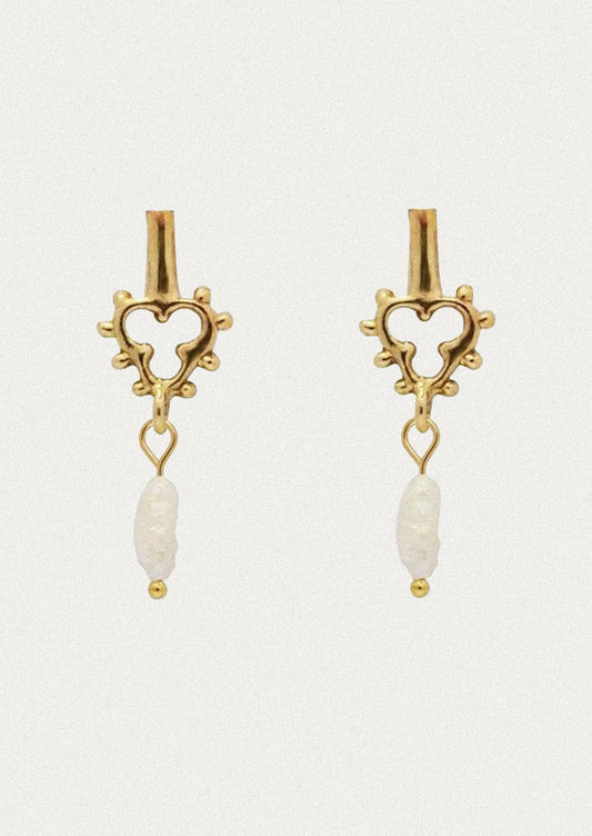 A pair of unique brass earrings with a dangling keshi pearl.