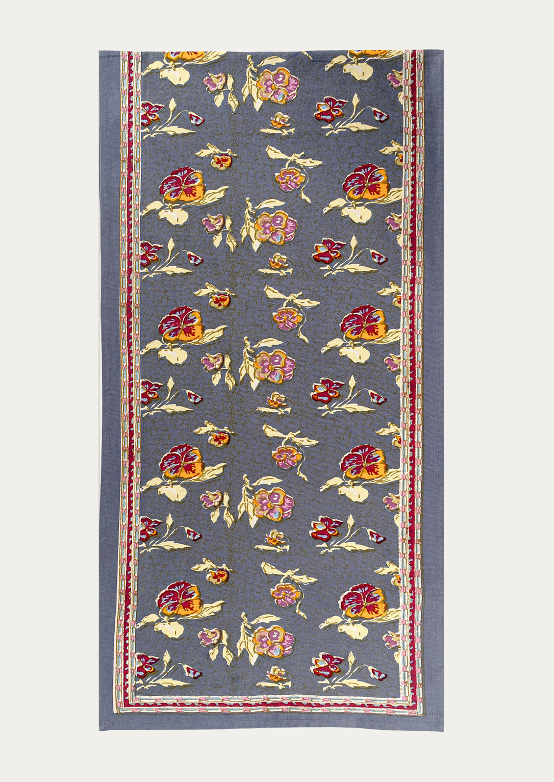 Floral patterned table runner on a plain background