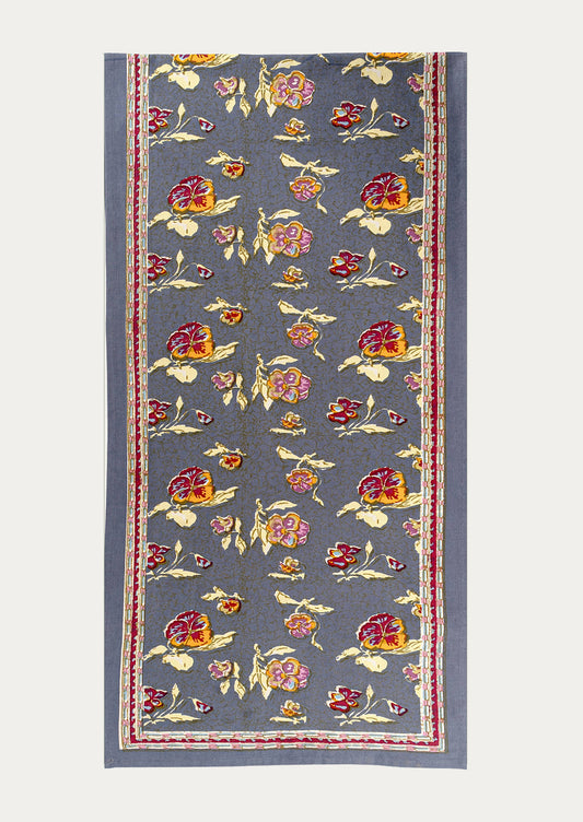 Floral patterned table runner on a plain background