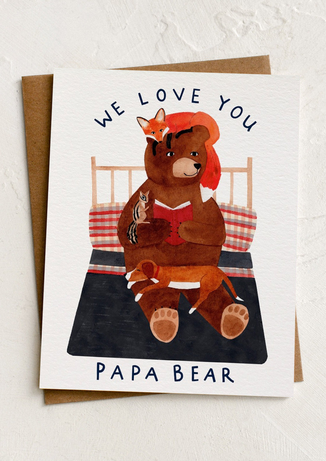 Card with illustration of a bear reading to cubs with text 'We love you Papa Bear' on a white background.