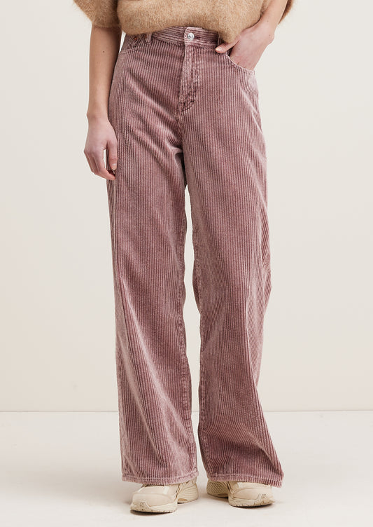 A pair of wide corduroy pants with wide leg and slouchy fit, in dusty mauve color.