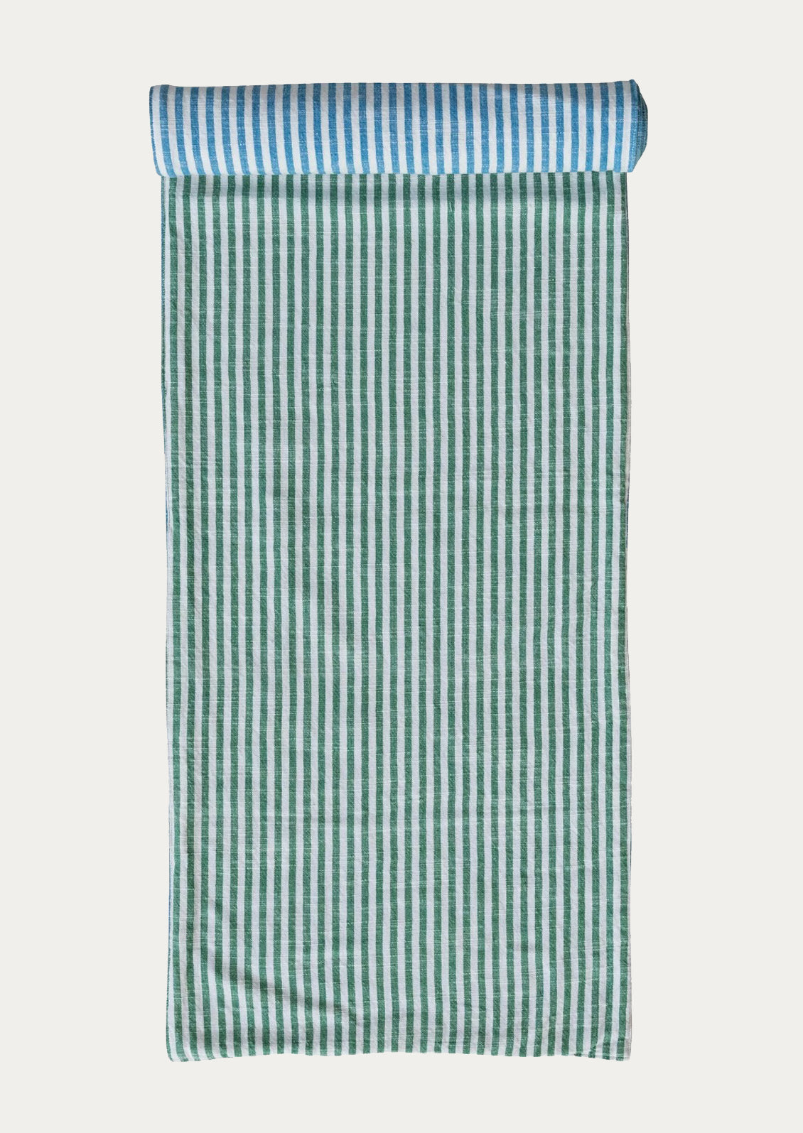 Green and white striped table runner with blue and white striped reverse side.