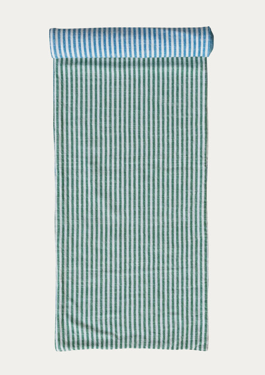 Green and white striped table runner with blue and white striped reverse side.