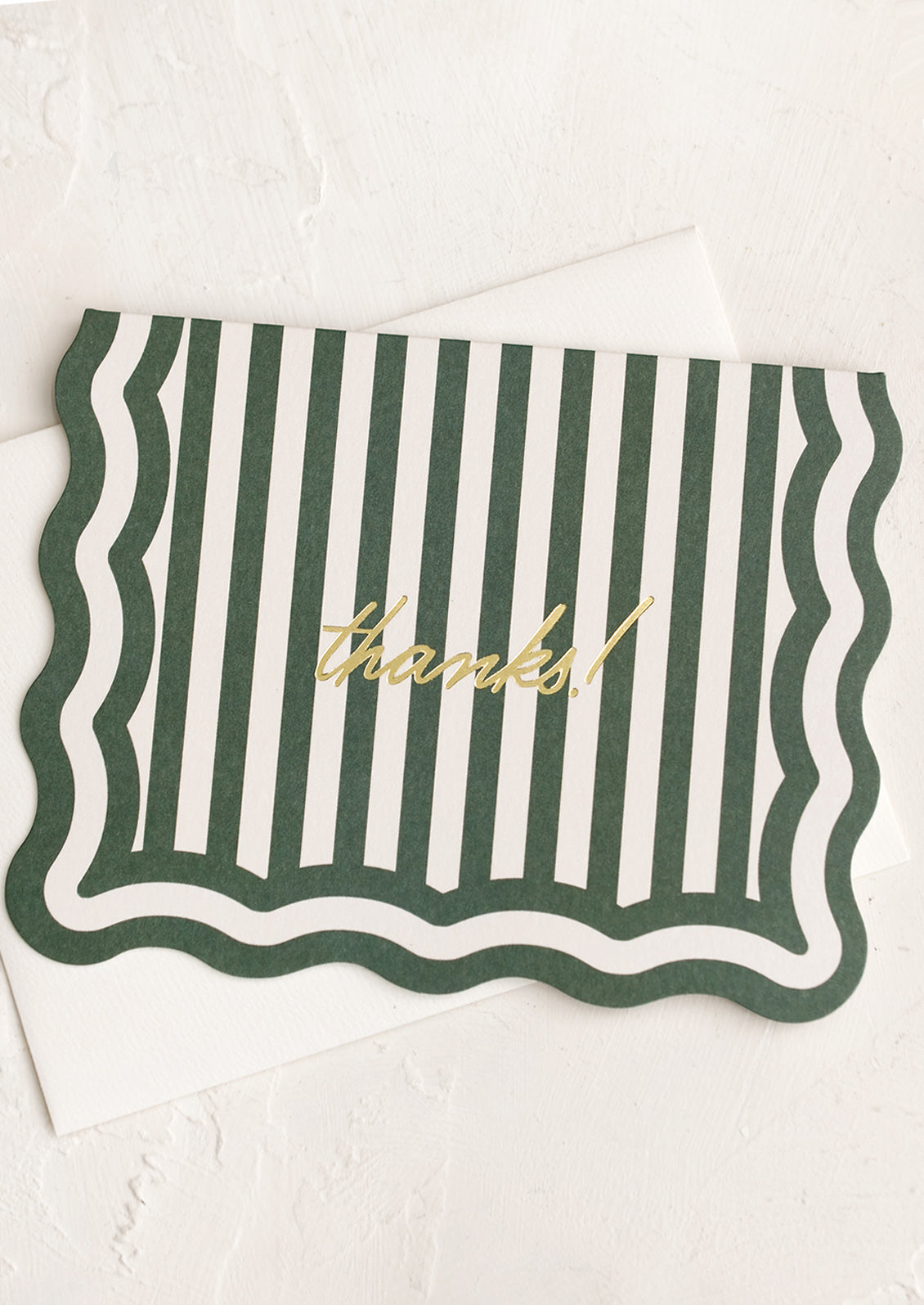 A wavy edge diecut card in green stripes reading "Thanks!".