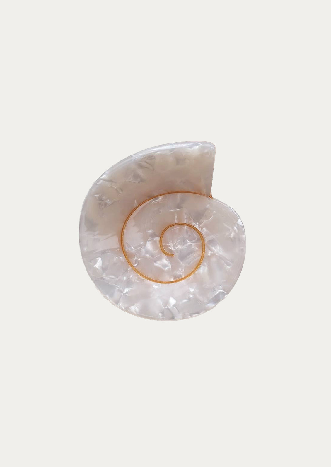 A nautilus shaped hair clip in pearl white.