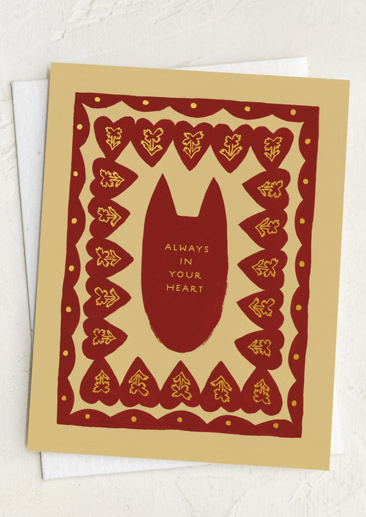 Card with a red silhouette of a cat and text 'Always in Your Heart' on a decorative border.