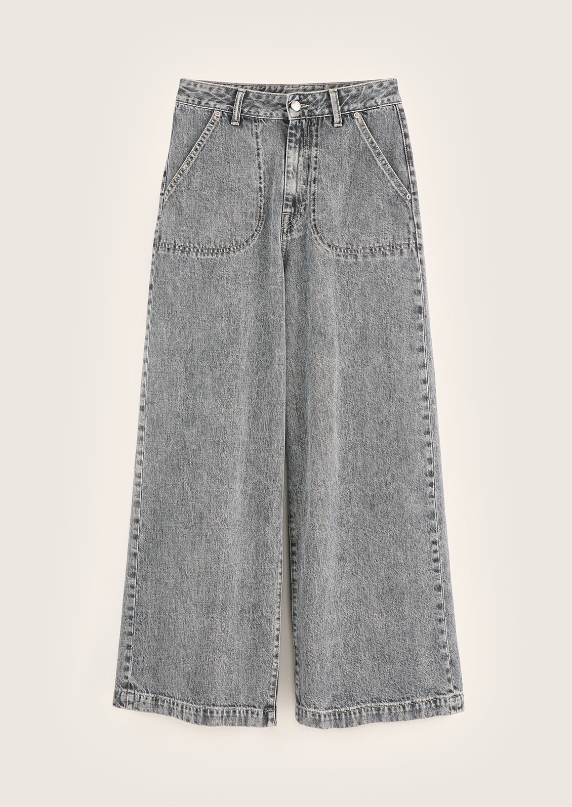 A pair of jeans in stonewashed blue-grey wash with front slant patch pockets.