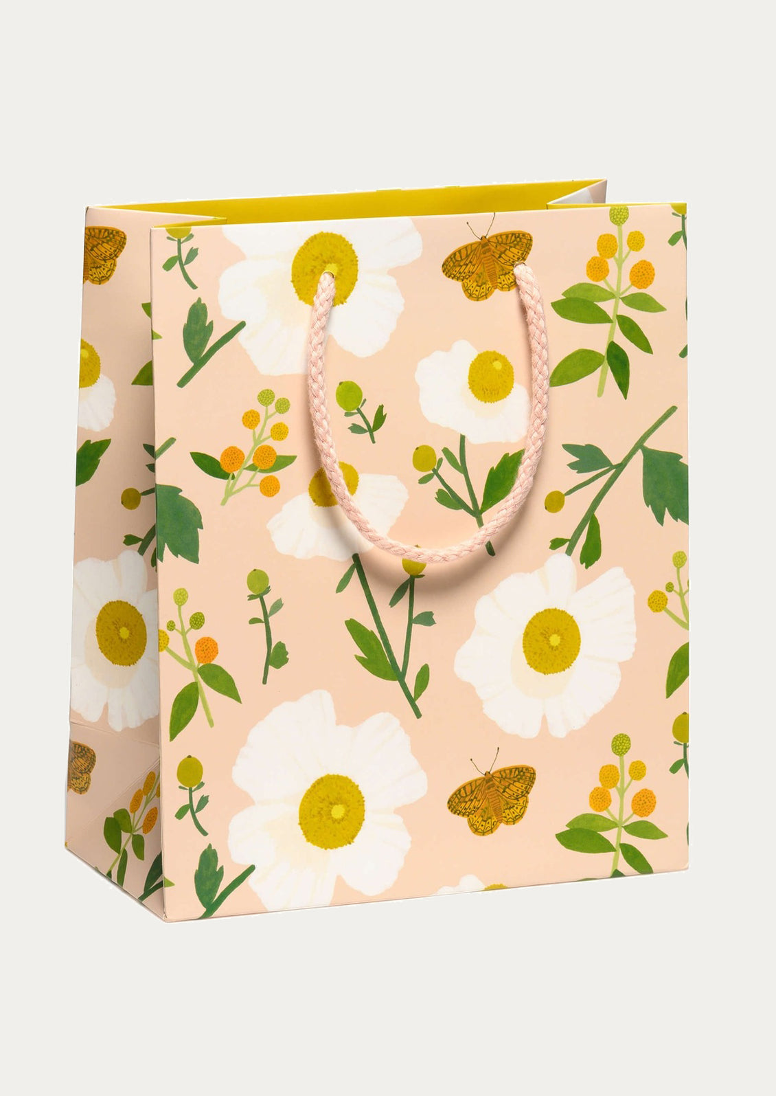 Floral patterned gift bag with a handle on a white background