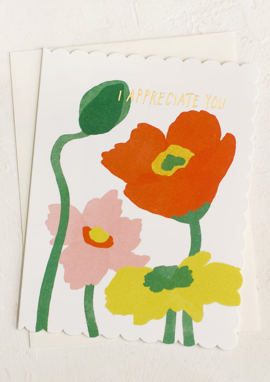 A greeting card with image of poppies and text reading "I Appreciate you".