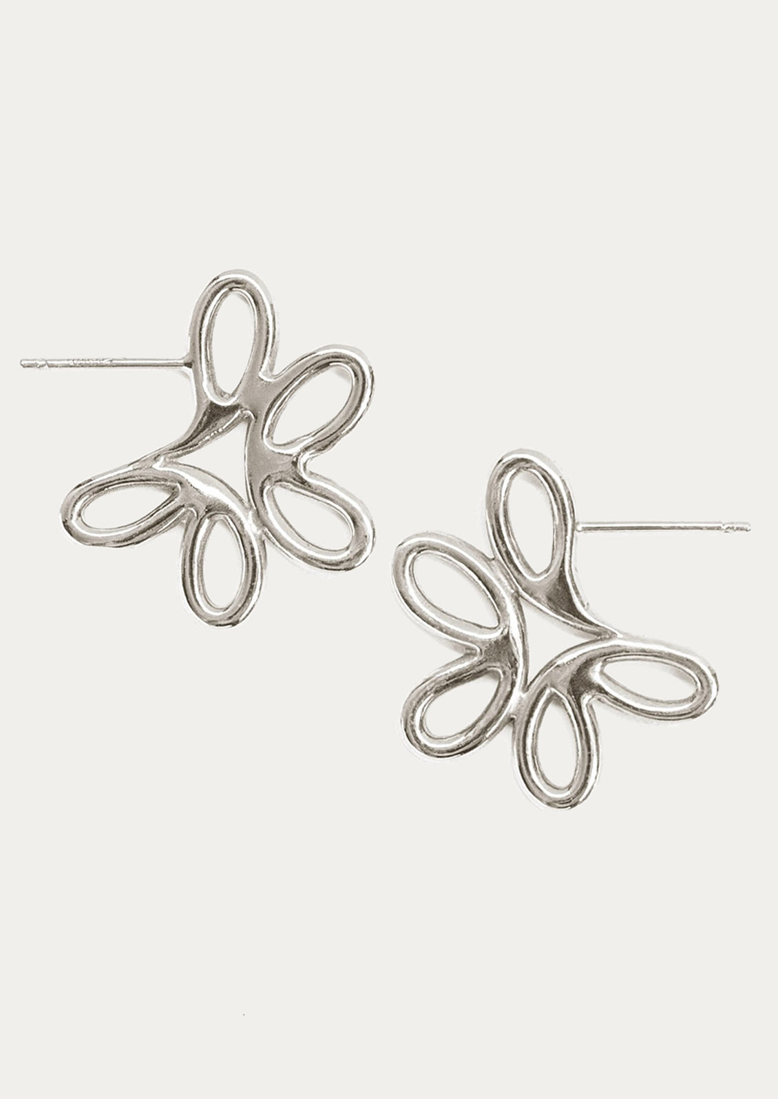 A pair of flower shaped earrings in sterling silver.
