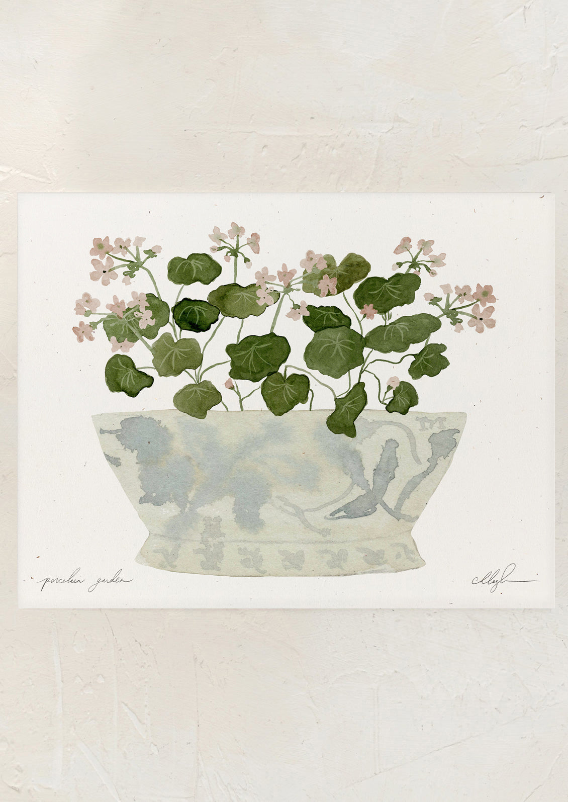 An art print of pink geraniums in vintage ceramic bowl.