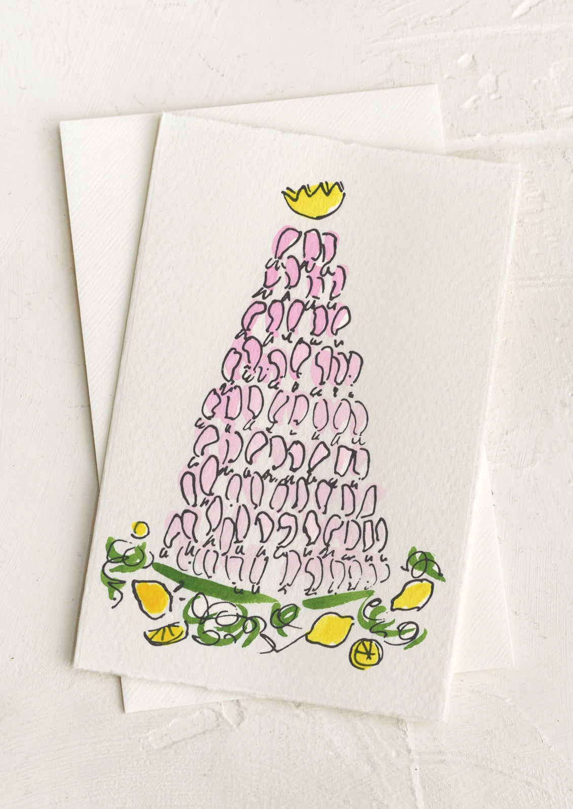 A greeting card with hand painted illustration of a shrimp tower, no text.