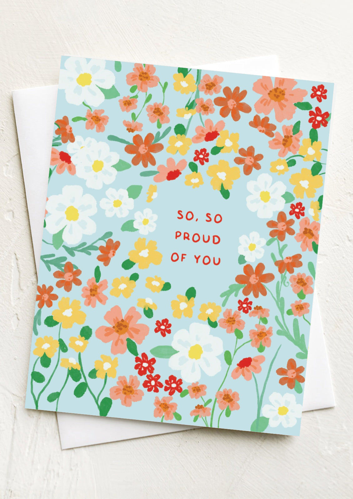 A floral print card with text reading "So, so proud of you.