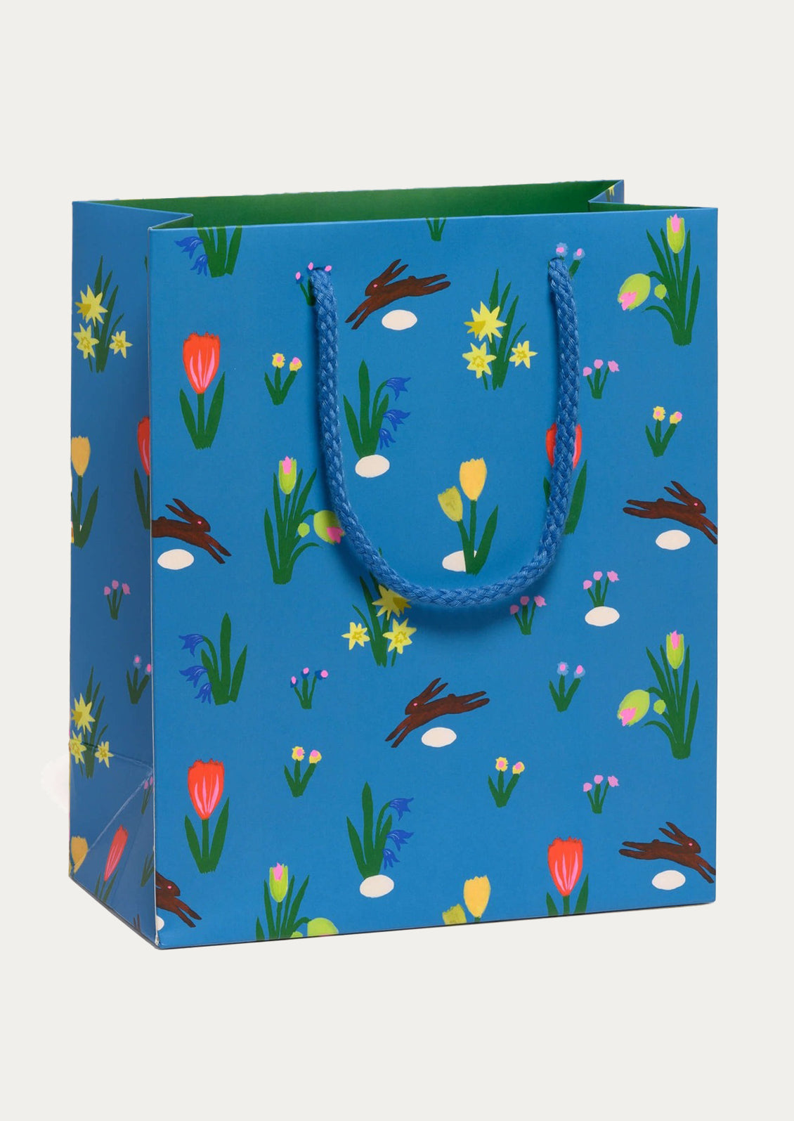 Blue gift bag with floral pattern on a white background